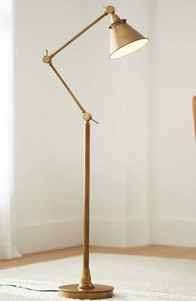 a floor lamp with a white rug in the background