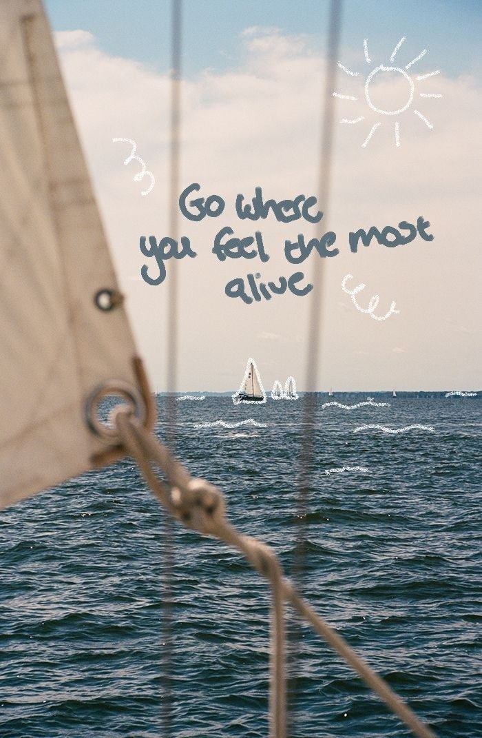 a sailboat sailing in the ocean with a message written on it's side