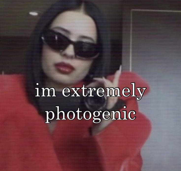 a woman wearing sunglasses and holding a cell phone to her ear with the caption i'm extremely photogenic