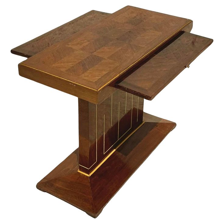 a wooden table that is sitting on some kind of stand up plated in the shape of a rectangle