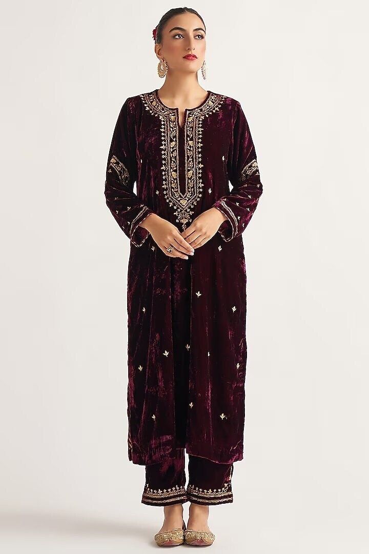 Featuring a wine kurta in velvet base with hand embroidery. It is paired with matching palazzo pants. This product will be shipped to you after 1-2 weeks from the date of order placed. All custom made orders are not returnable. Pls contact for Size chart and for other more colors Request You :To provide contact details for courier services. {VARIATION MAY COME DEPENDING UPON AVALIBILITY OF LACES OR GOTTA PATI or TUSSELS} NOTE:  1) Visual Samples on website may differ slightly from actual product due to light & effects during photography (Length & Breadth have 1 n 1.5 inches +/-). 2) Before placing order ,pls confirm product n color availability and  For Wholesale Order MOQ is 5 Pieces of any color/Pattern on +91 7903893945 & +91 8447750028(WhatsApp) Bridal lehanga ,indian wedding,Canada we Printed Velvet Suits Women Indian, Velvet Outfit, Velvet Suit Design, Velvet Kurta, Velvet Embroidery, Independance Day, Velvet Dress Designs, Winter Suit, Velvet Suit