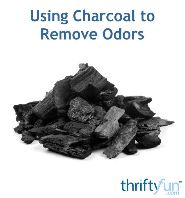 a pile of charcoal next to the words using charcoal to remove odors