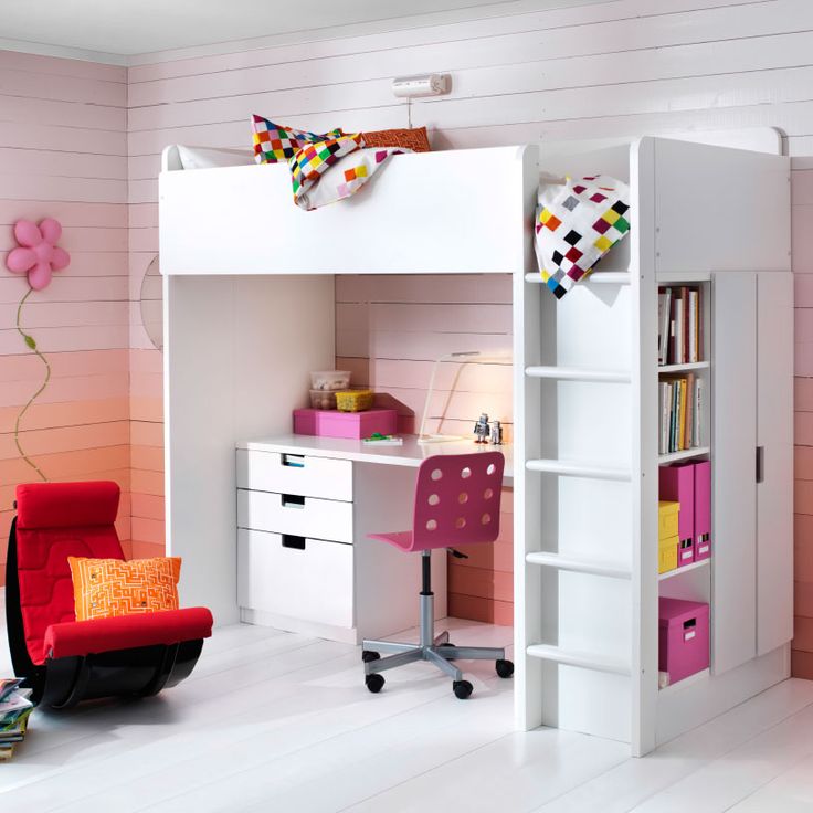 a white loft bed with pink drawers and desk