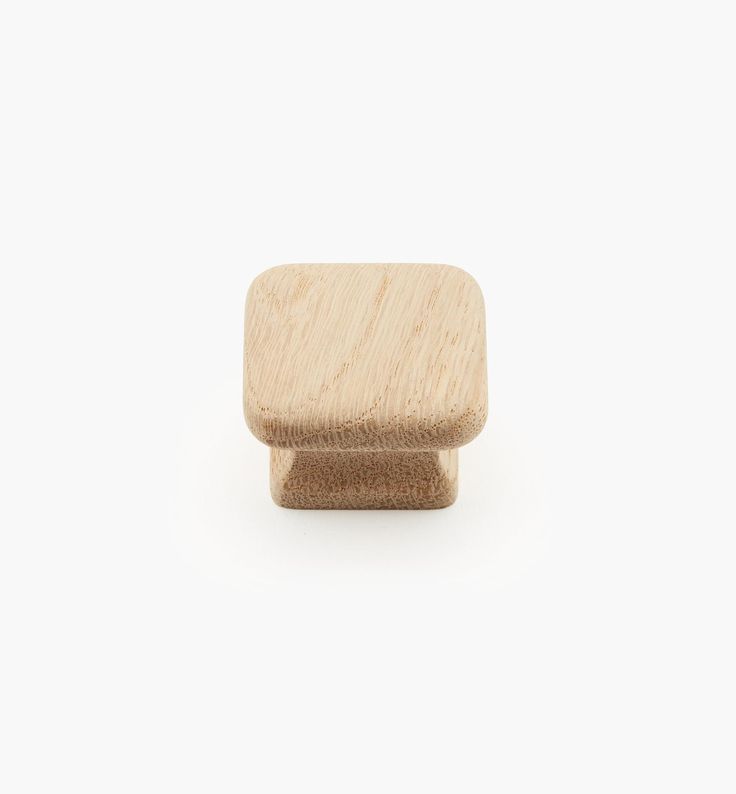 a wooden knob on a white background