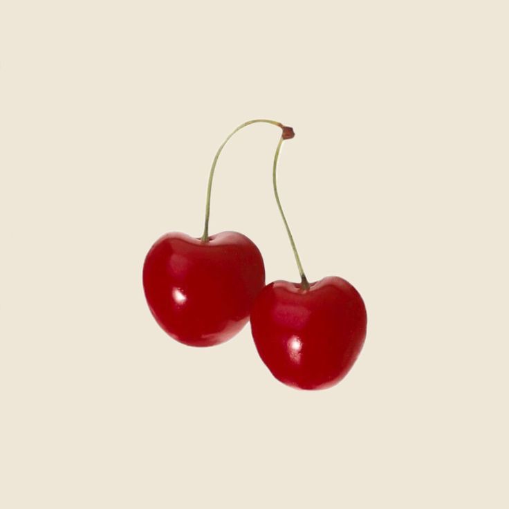 two cherries on a white background