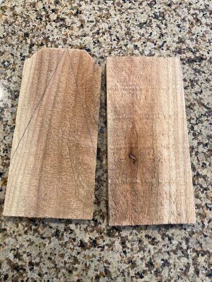 two pieces of wood sitting on top of a counter