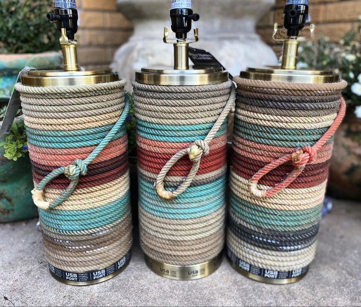 three different colored ropes wrapped in rope next to each other