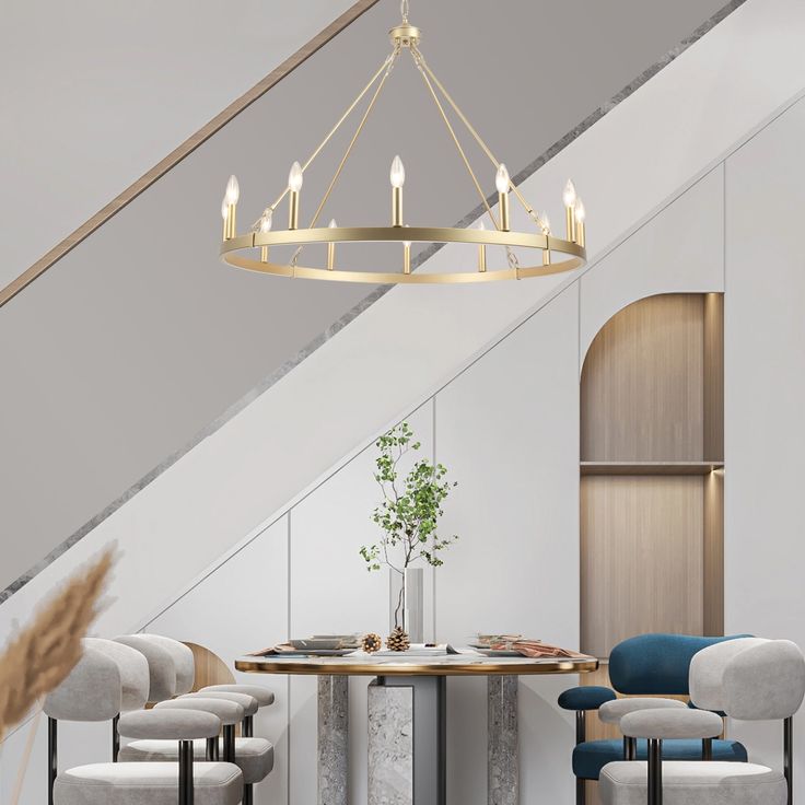 a dining room table with chairs and a chandelier hanging from the ceiling above it