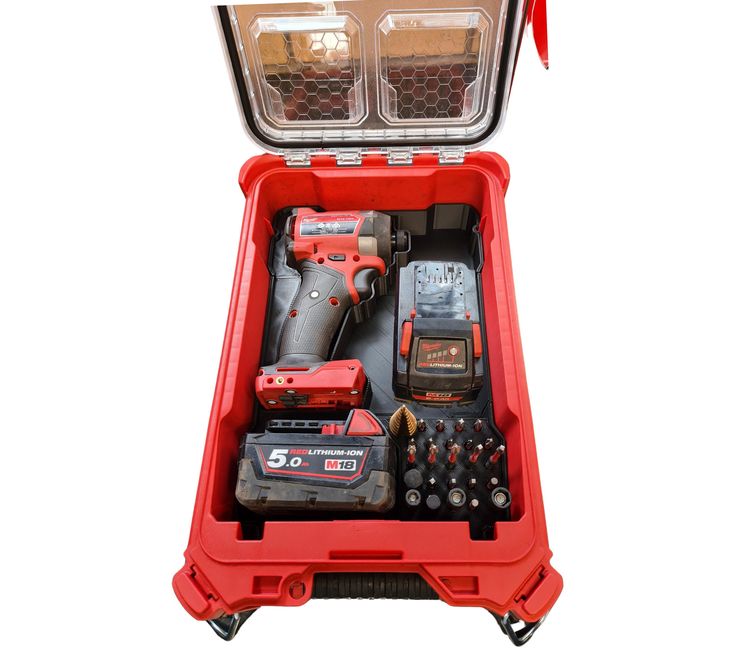 a red tool box filled with tools on top of a white background