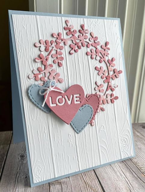 a handmade card with two hearts on it