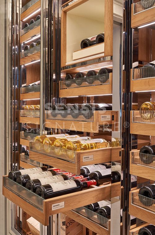 the shelves are filled with many different types of wine