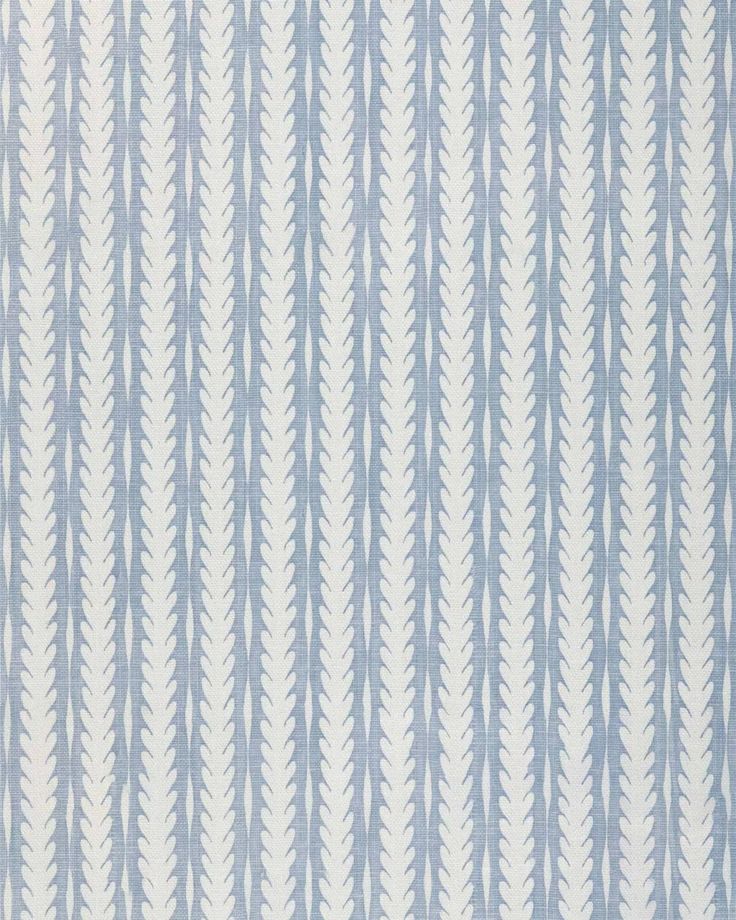 a blue and white striped wallpaper with wavy lines