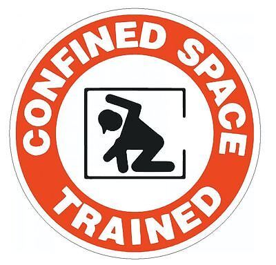 a red and white sign with the words confined space trained in black on an orange circle