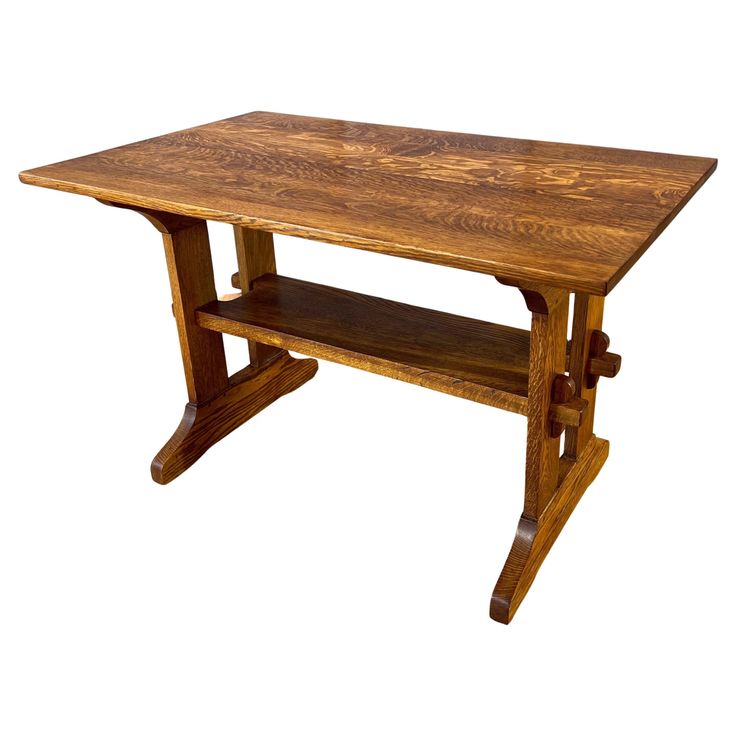 a wooden table with two shelves on the top and one shelf below it, against a white background