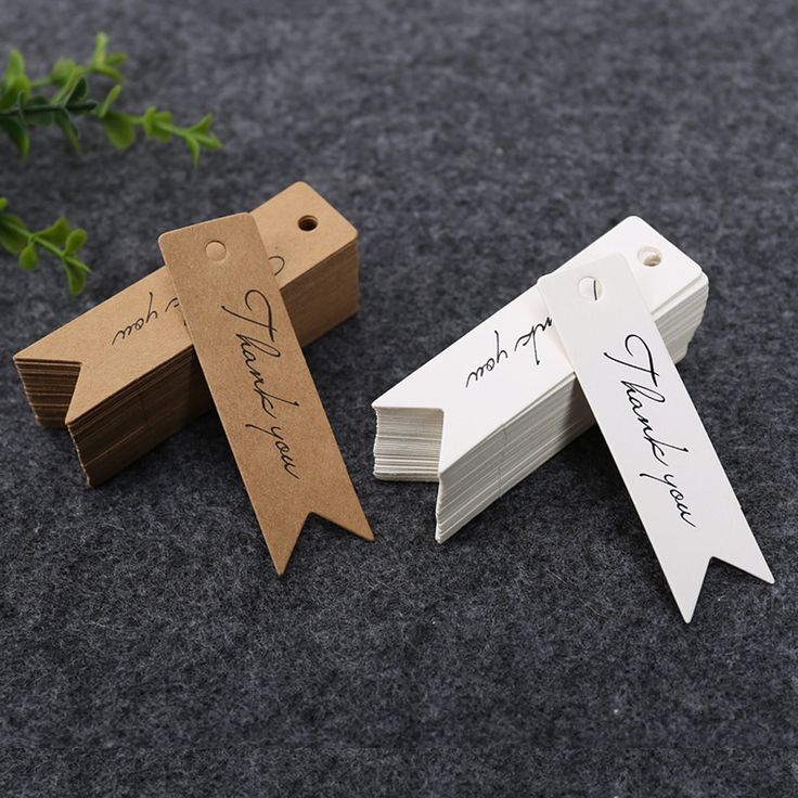 two wooden tags with names on them sitting next to each other