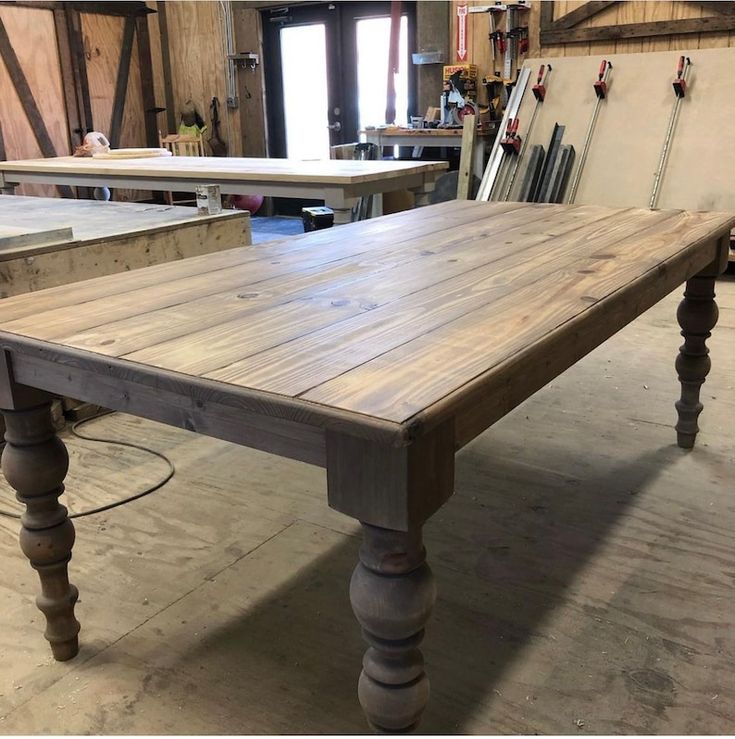 an old wooden table is being worked on