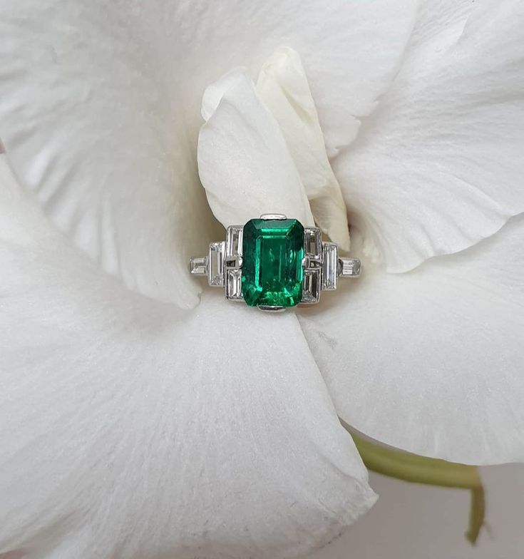 4 CT Green Emerald Cut Side Baguette Cut Multi Stone Engagement Ring 10K 14K 18K Solid White and Rose Gold Wedding Ring Anniversary Ring Bridal Ring R I N G M E T A L ✥ Metal :  925 Sterling Silver, 10K 14K 18K Solid White Yellow and Rose Gold ✥ Metal Clarity : Pure ✥ Stamp/Hallmark : Yes M A I N S T O N E S ✥ Type : Moissanite Diamond ✥ Shape : Emerald Cut ✥ Weight : 4 Ct ✥ Diamond Color : Green ✥ Clarity : VVS1 ✥ Diamond Cut : Excellence S I D E S T O N E S ✥ Type : Moissanite Diamond ✥ Shape : Baguette Cut ✥ Weight :  1.85  Ct ✥ Color : White ✥ Clarity : VVS1 ✥ Cut : Very Good R I N G S I Z E S ✥ All Ring Size are Available ✥ If You Have any Questions With Regards to Sizing Please Contact as S H I P P I N G ✥ Free Express Delivery ✥ No Extra Charge For Delivery  ✥ Fastest  Delivery Avai Art Deco Emerald Ring In Baguette Cut White Gold, Octagon Emerald Ring In Platinum For Wedding, Octagon Emerald Platinum Ring For Wedding, Wedding Baguette Cut White Gold Emerald Ring, Wedding White Gold Emerald Ring Baguette Cut, Baguette Cut Emerald Ring For Anniversary, Rectangular Emerald Ring In White Gold For Wedding, Classic Emerald Ring With Baguette Diamonds For Anniversary, Classic Emerald Ring With Baguette Diamonds For Wedding