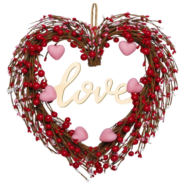 a heart shaped wreath with the word love hanging from it's center, surrounded by red berries