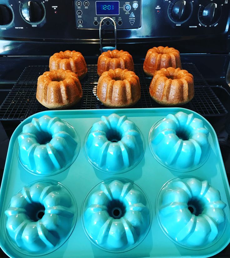 several bundt cakes are sitting in an oven