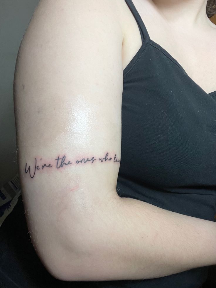 a woman with a tattoo on her arm that says, wine the ones who lie