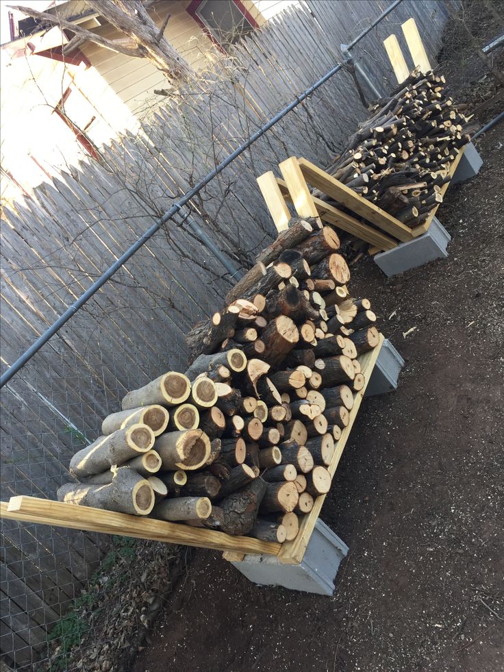 several piles of logs stacked on top of each other