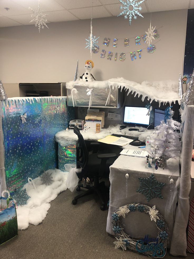 an office decorated for christmas with snowflakes and decorations