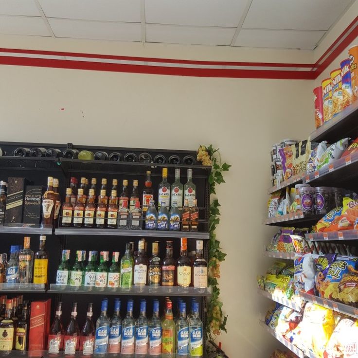 a store filled with lots of different types of drinks and condiments on shelves