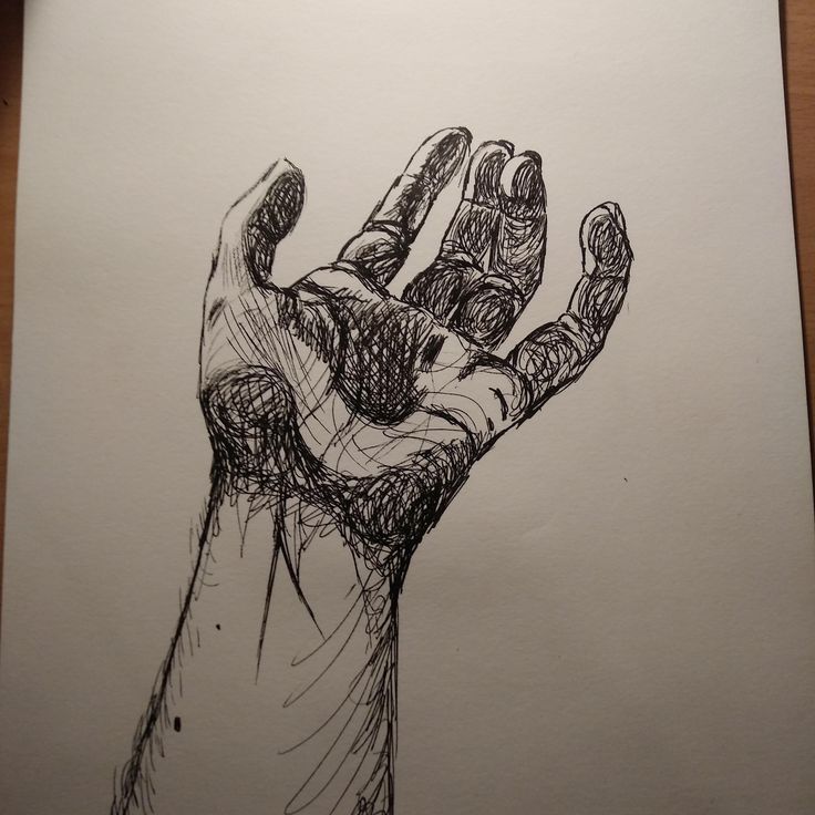 a drawing of a hand holding something in it's right hand on top of a piece of paper