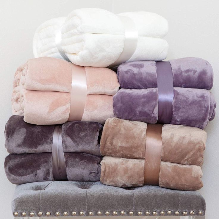 towels stacked on top of each other in different colors