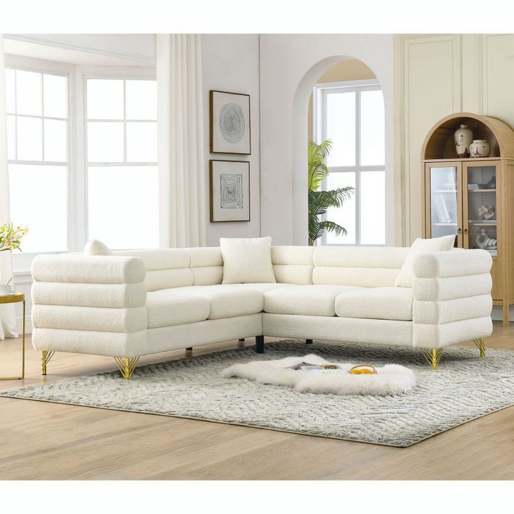 a white sectional sofa in a living room