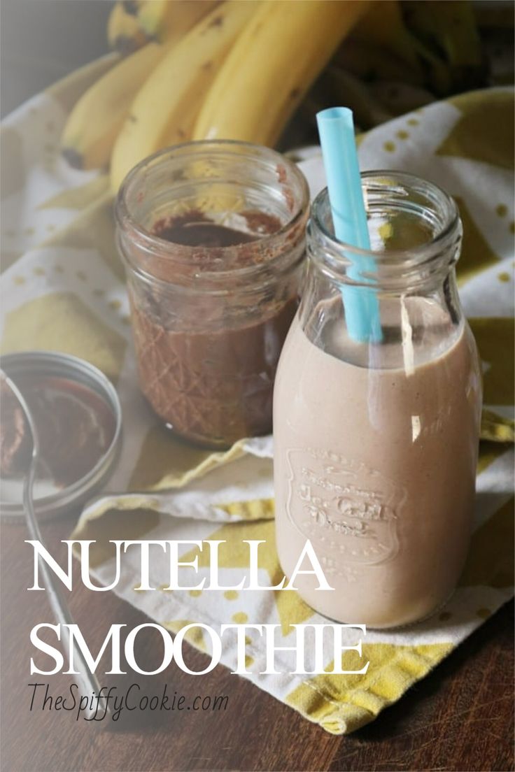 nutella smoothie in a mason jar with two blue straws on the side