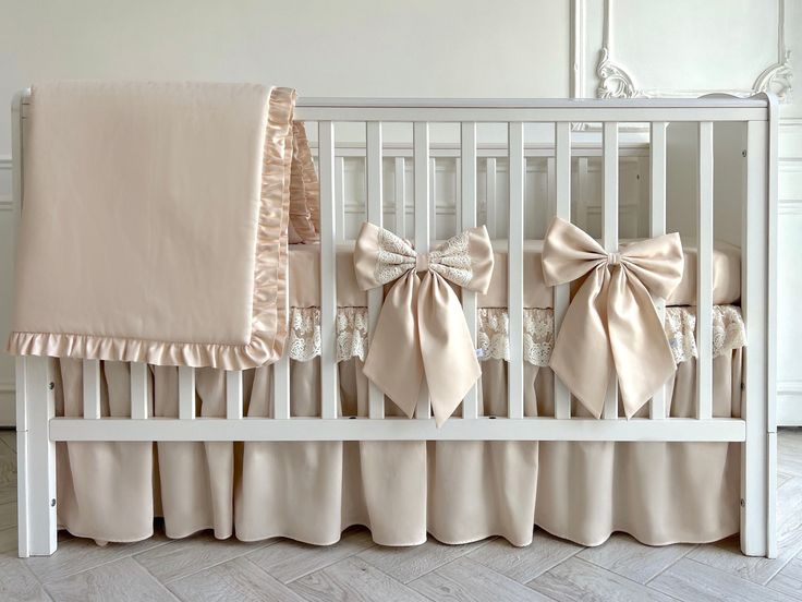 a baby crib with some bows on it