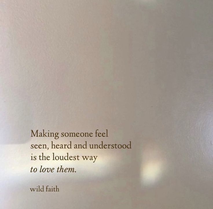 a white wall with a quote on it that says making someone feel seen, heard and understrood is the loudest way to love them