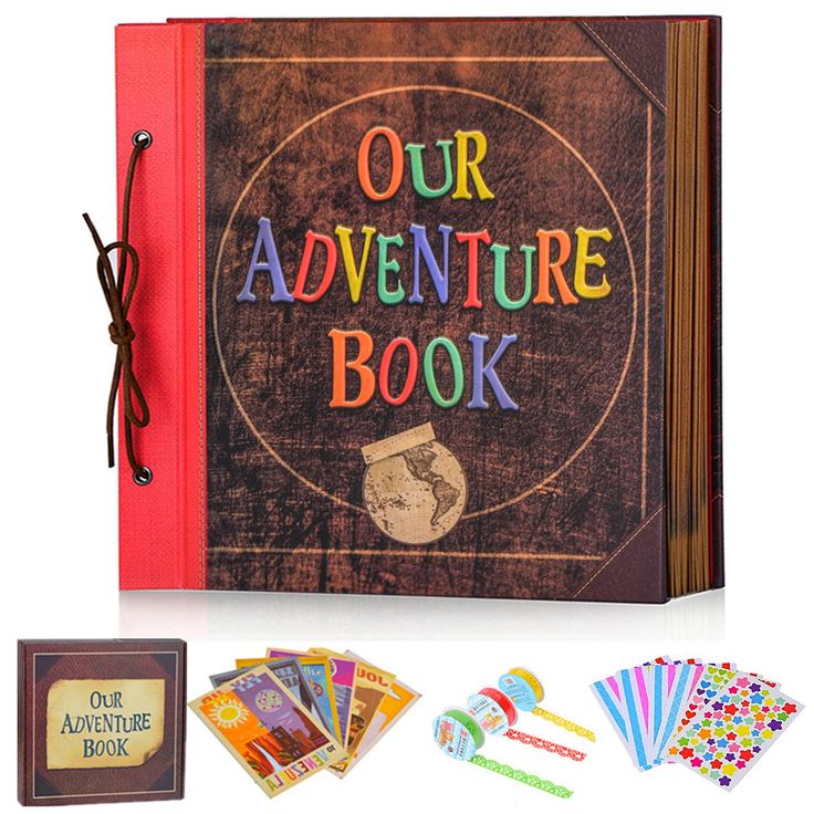 the book is open and has several cards in front of it, including an adult's adventure book