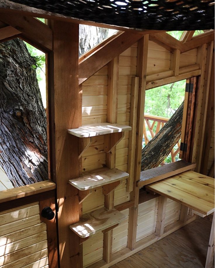 the inside of a tree house with stairs