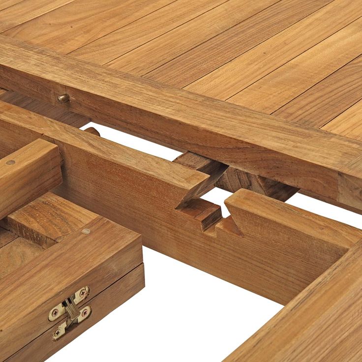 a wooden table with two drawers on each side