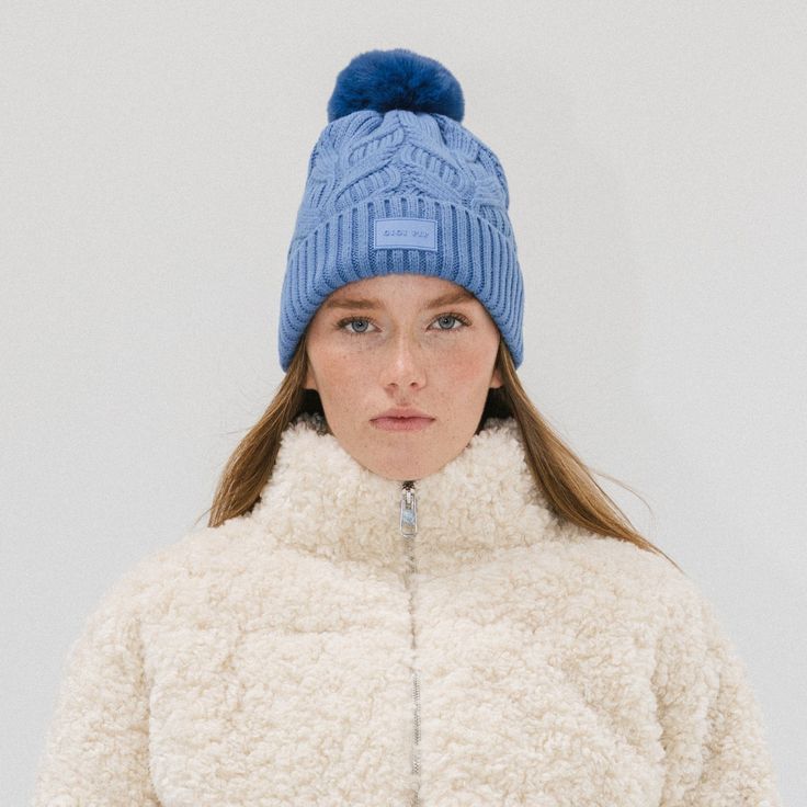 A winter classic. The Ida is a chic cable knit beanie with a classic silicon Gigi Pip label + fluffy faux fur pom in 3 staple colors. This lightweight fold over style is exactly what you need to keep you warm throughout the chilly winter szn, whether your home town is a snowy tundra or even just gets below 50's! Create the ultimate monochromatic winter look by pairing with other popular styles from the Winter Resort Collection HERE! Winter Cable Knit Beanie, Fall Cable Knit Beanie For Cold Weather, Winter Cable Knit Hats For Cold Weather, Casual Cable Knit Beanie For Winter, Winter Cable Knit Beanie One Size, Cozy Cable Knit Winter Hat, Cold Weather Cable Knit Hat, Cozy Cable Knit Winter Beanie, Cozy Cable Knit Beanie For Winter