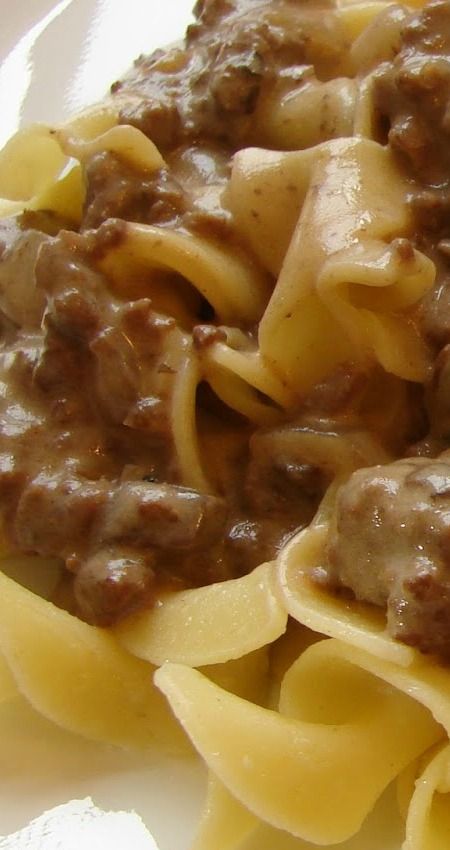 pasta with meat sauce and noodles on a white plate