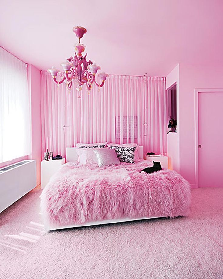 a pink bedroom with a chandelier hanging from the ceiling and a quote about it