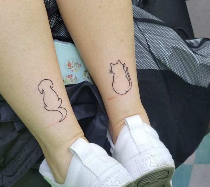 two people with matching tattoos on their legs, one has a cat and the other has a squirrel