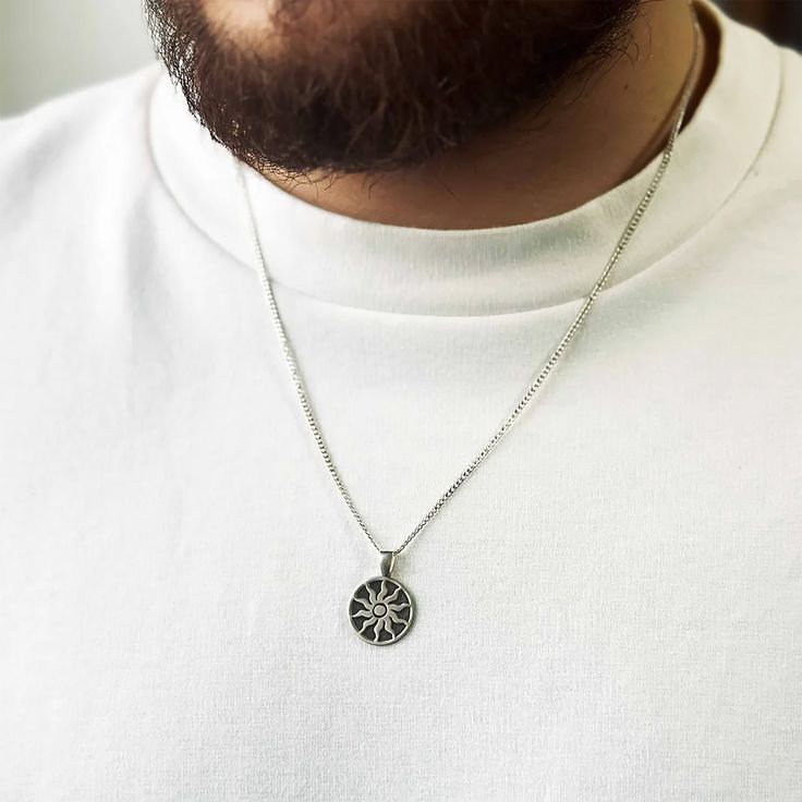 Sun Sterling Silver Engraved Coin Pendant Necklace is a dainty necklace. The coin pendant is engraved with your own message, making it the perfect personalized gift for any man in your life. This necklace is a perfect gift for men. It's meaningful, unique and well-made. The front side of the coin necklace is engraved with 'Sun' which represents light and masculine energy. The backside of the coin pendant is engraved with your special words so that it could be personalised just like a message in Spiritual Silver Necklace With Engraving Option, Medallion Pendant Necklace With Compass Design For Gift, Compass Design Medallion Pendant Necklace Gift, Engraved Stainless Steel Jewelry With Initial Pendant, Symbolic Medallion Necklace With Engraving Option, Engraved Stainless Steel Medallion Jewelry, Symbolic Silver Necklace With Laser Engraving, Symbolic Silver Jewelry With Laser Engraving, Medallion Necklace With Compass Design For Gift