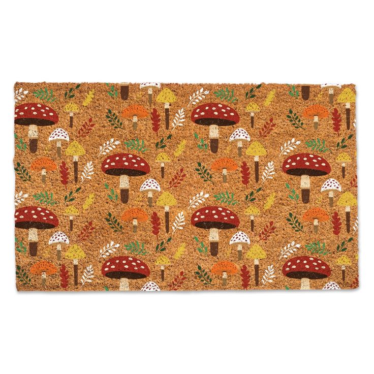 a door mat with mushrooms and leaves on it