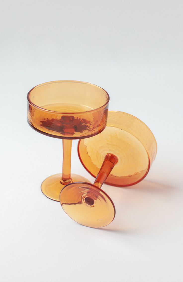 two glass dishes sitting on top of each other