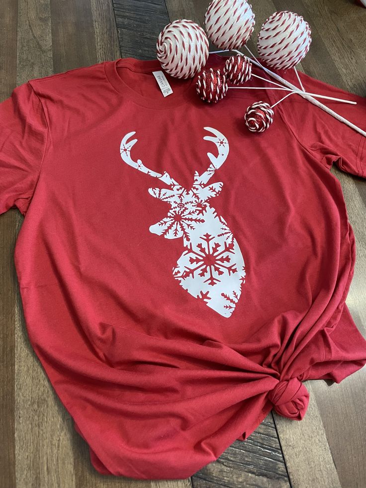 This adorable reindeer t-shirt is a great addition to your winter apparel! Simple in design and comfortable in wear! Available in our heavy blend fleece sweatshirt or t-shirt, each is cozy and perfect for this winter season! Durable and a classic casual each, it will withstand everyday wear. For longevity and best wear results, wash and dry inside out or hang to dry. Do not iron. Sweatshirts are made on Gildan 18000, for suggested sizing, see the size chart in photos. T-shirts are made on unisex Bella Canvas Tees for the best quality, style and comfort! For suggested sizing, see the Bella Canvas size chart in photos. Santa's Reindeer, Cricut Shirts, Reindeer Shirt, Winter Apparel, Autumn T Shirts, Santa Shirts, Bella Canvas Tees, Classic Casual, Red T