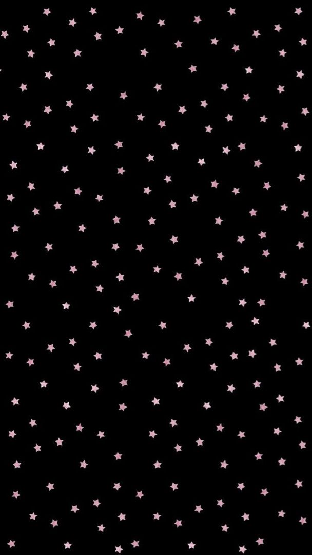 small pink stars on a black background