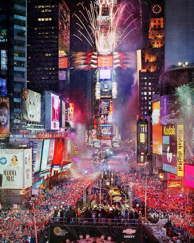 the new york times square is lit up with fireworks