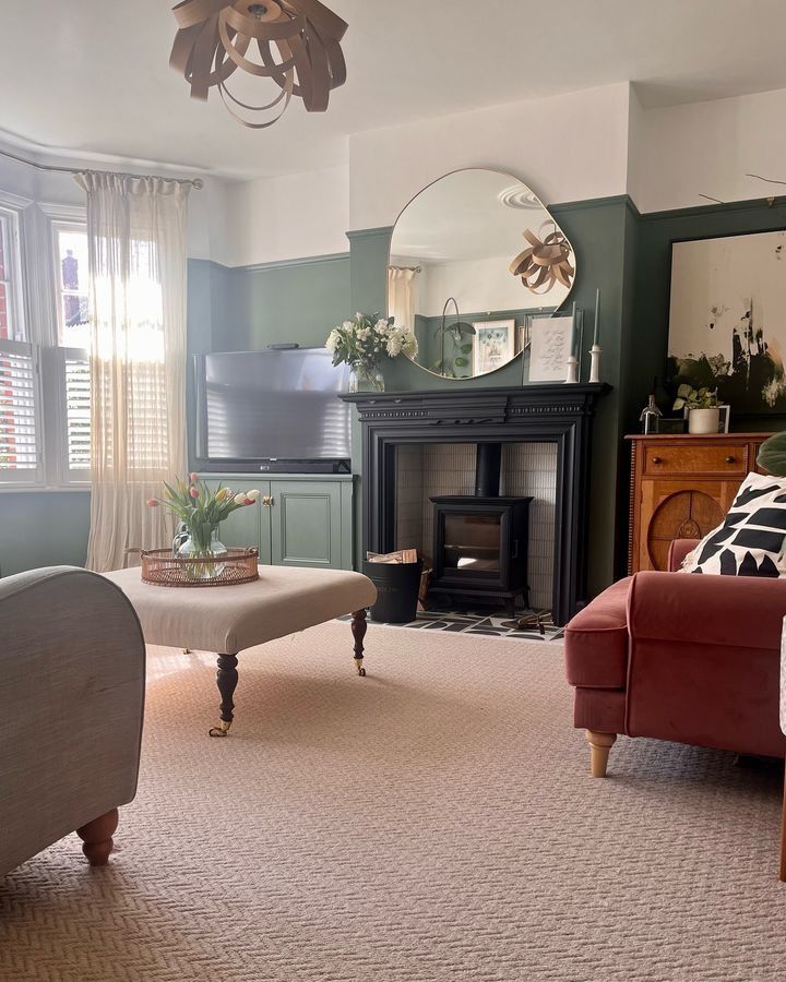 a living room filled with furniture and a fire place