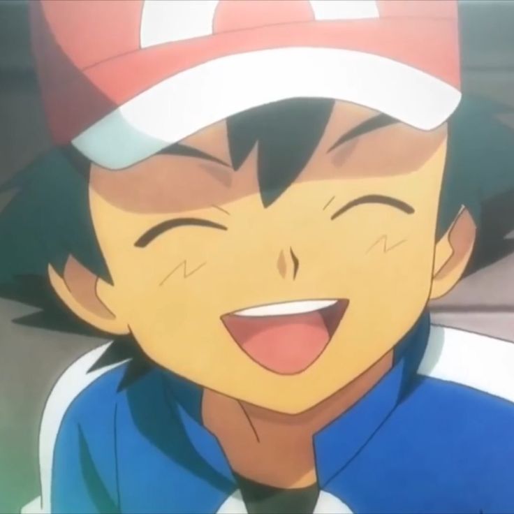 a young boy wearing a baseball cap and smiling