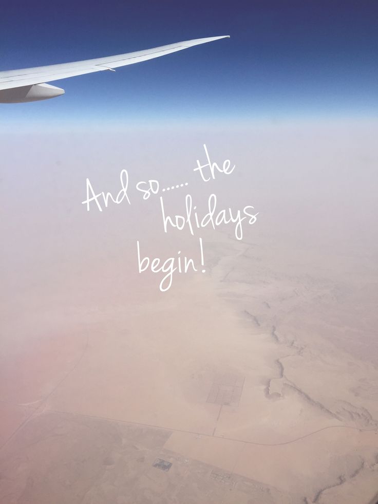 an airplane wing with the words and so the holidays begin