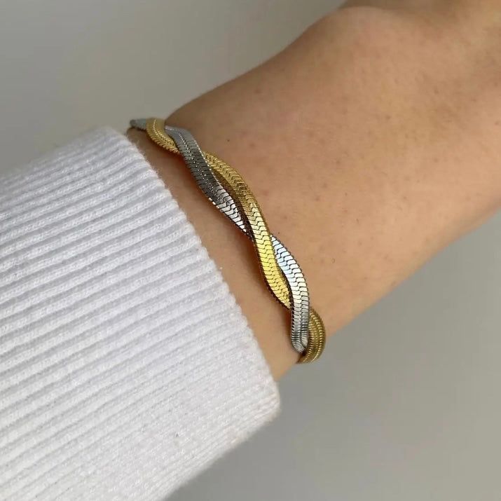 Our Eleanor Watchband Bracelet adds a trendy and timeless touch to any outfit. The perfect accessory for those looking to exude girl boss vibes. Made with high-quality materials for durability and style. Elevate your look and make a statement with this must-have piece. 316L Stainless Steel 18K PVD Gold Plated 6.5 inches long +2" inches ext/ 7mm wide Trendy Metal Bracelets Tarnish Resistant, Chic Everyday Bangle With Bracelet Strap, Trendy Metal Bracelets With Tarnish Resistance, Chic Tarnish Resistant Metal Bracelets, Trendy Gold Cuff Bracelet, Trendy Metal Bangle For Everyday, Trendy Stainless Steel Jewelry As Fashion Accessory, Trendy Adjustable Braided Bangle Bracelet, Chic Stainless Steel Jubilee Bracelet